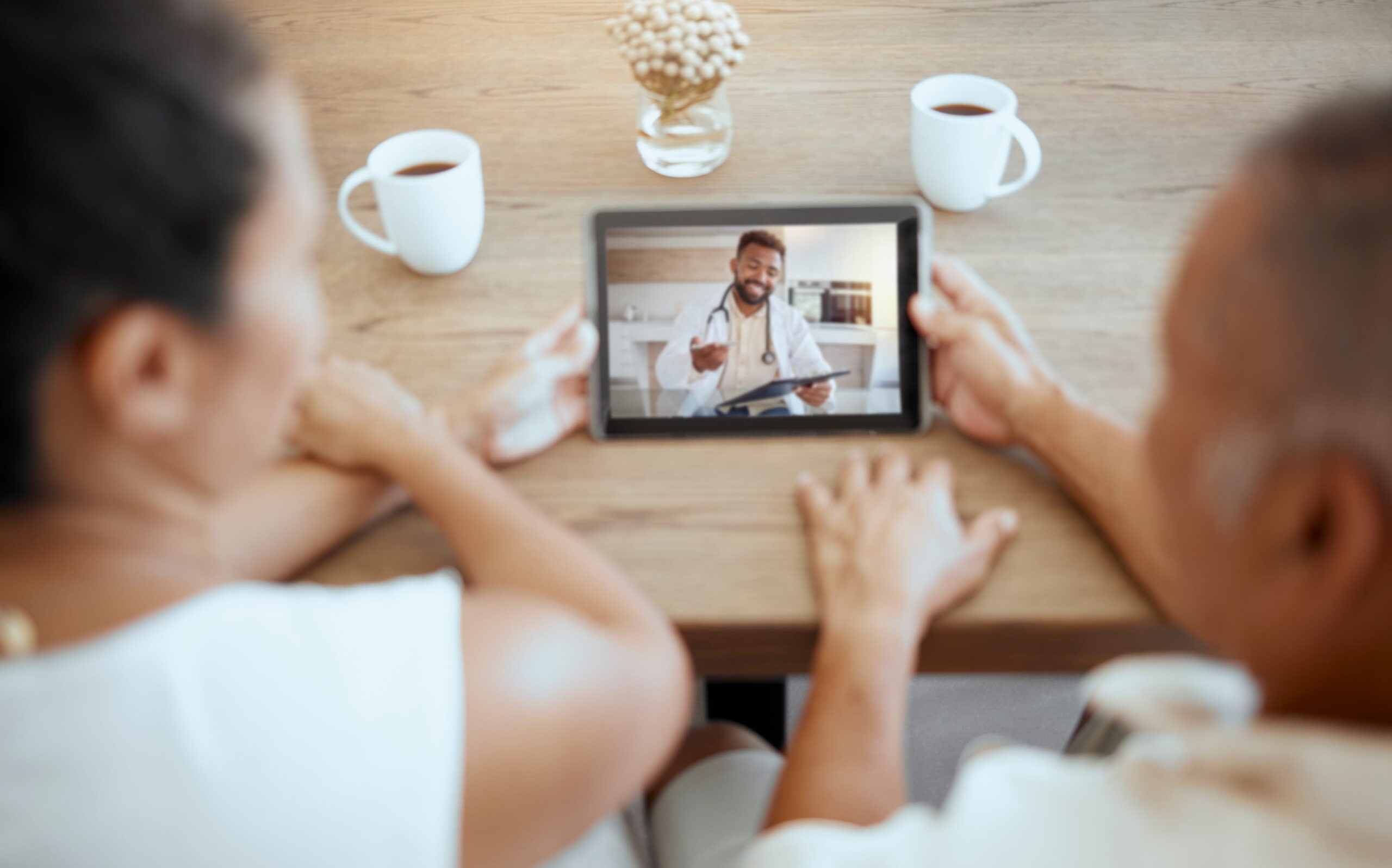 Diverse couple telehealth visit video call health care